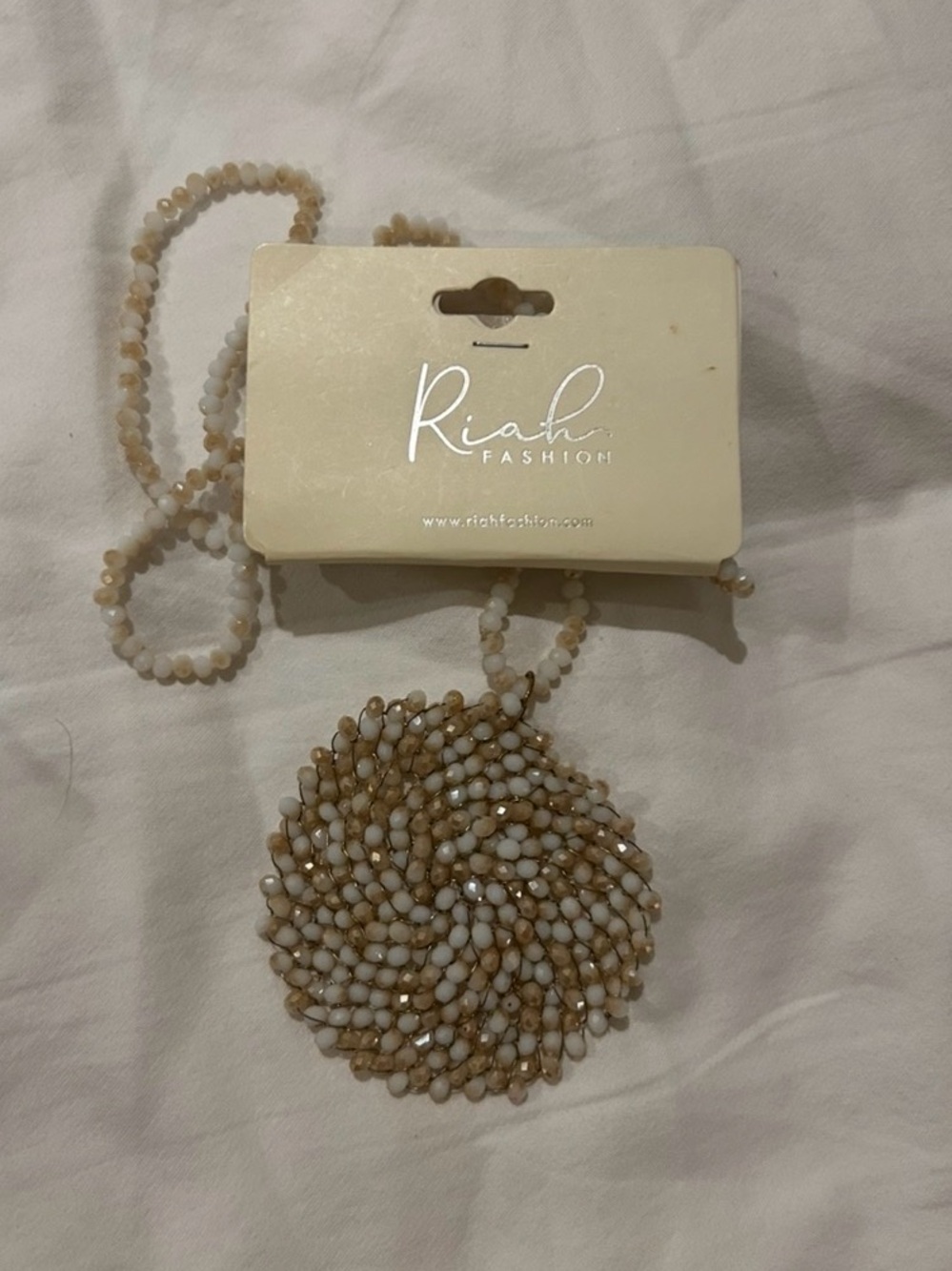 Riah Fashion Cream Beaded Spiral Pendant Necklace